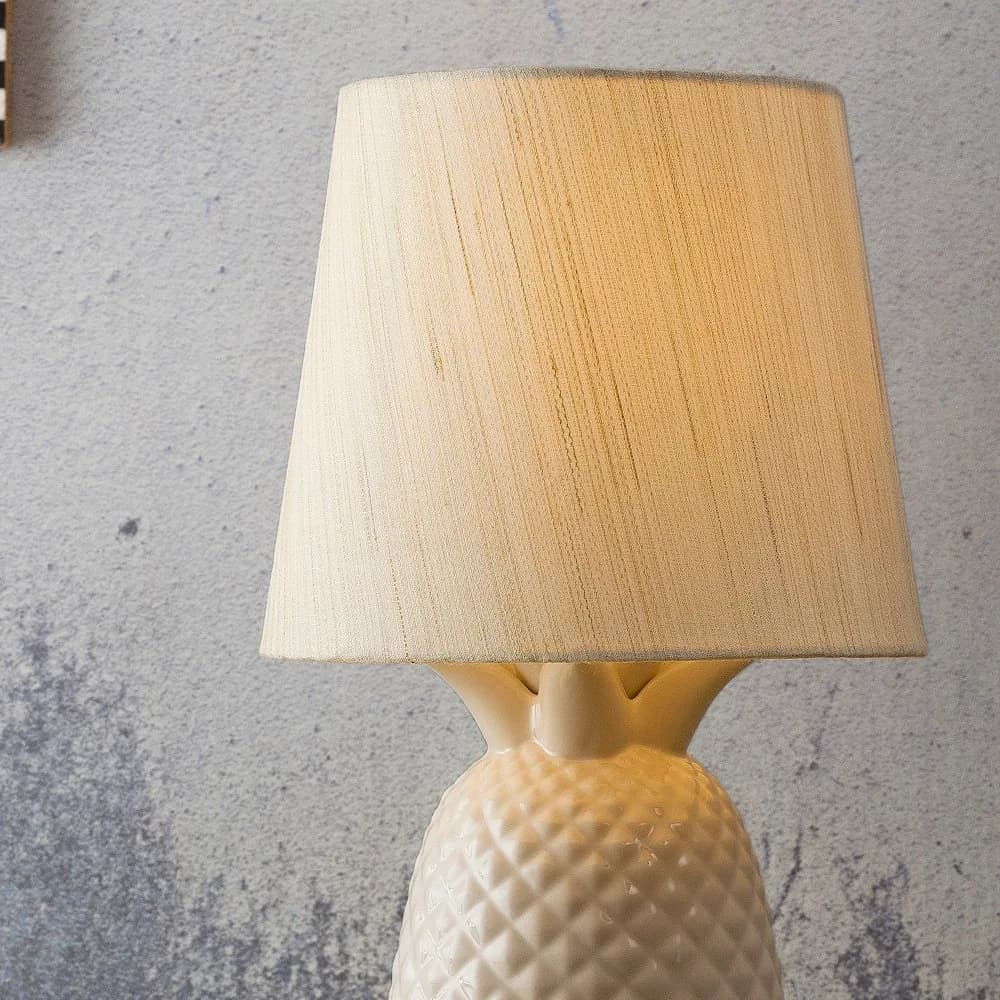 Ceramic table lamp with linen shade, close-up